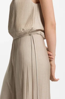Halterneck jumpsuit in lustrous jersey with plissé pleats