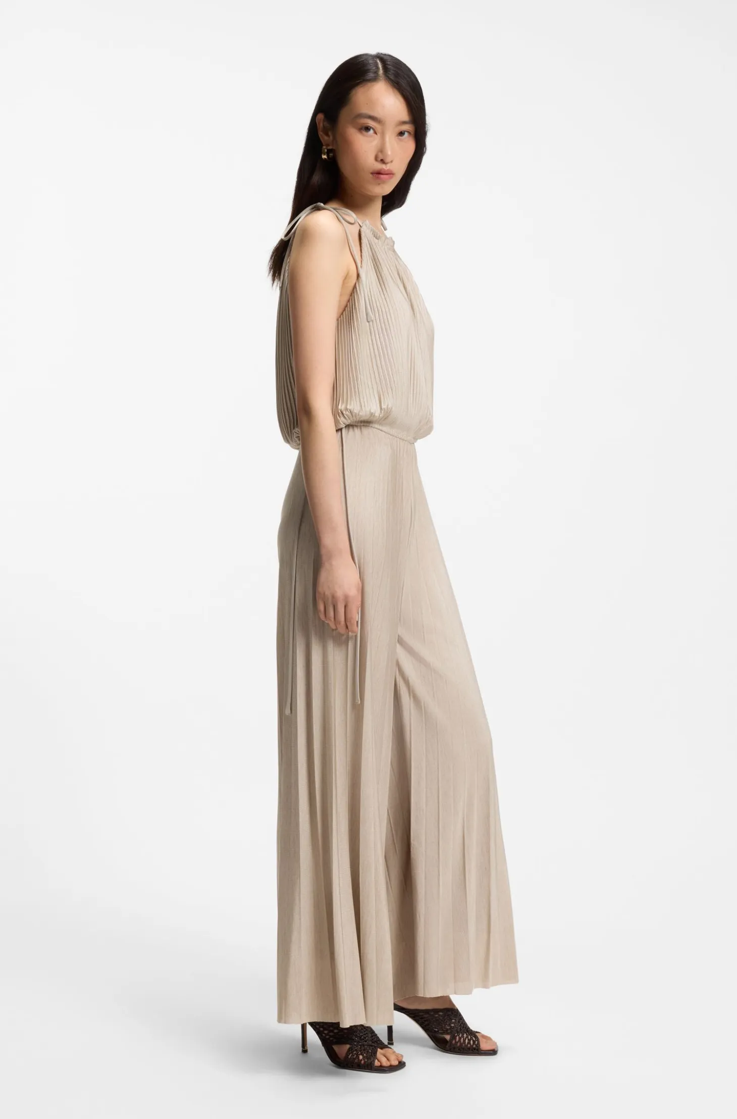 Halterneck jumpsuit in lustrous jersey with plissé pleats