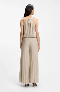 Halterneck jumpsuit in lustrous jersey with plissé pleats