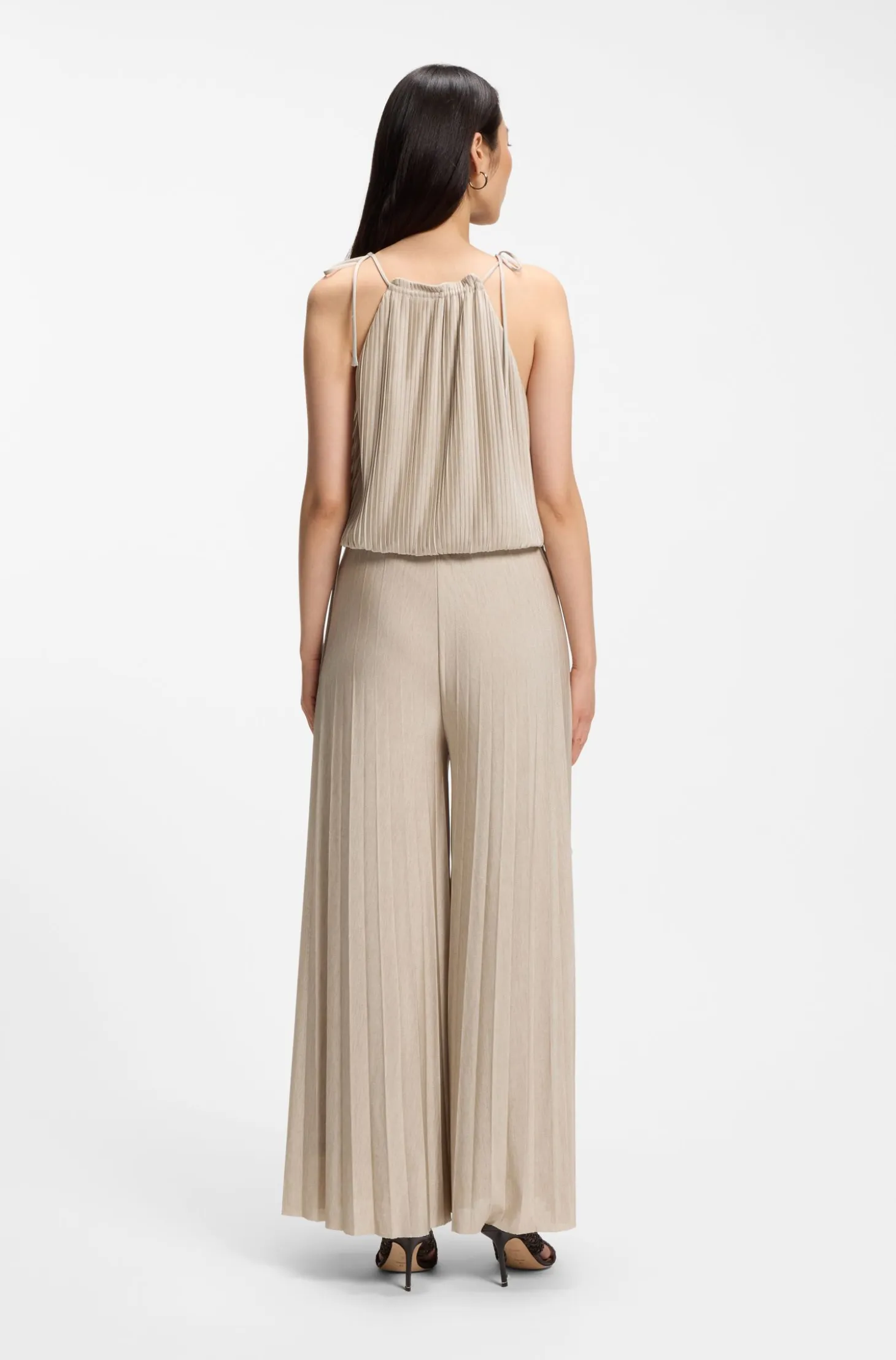 Halterneck jumpsuit in lustrous jersey with plissé pleats
