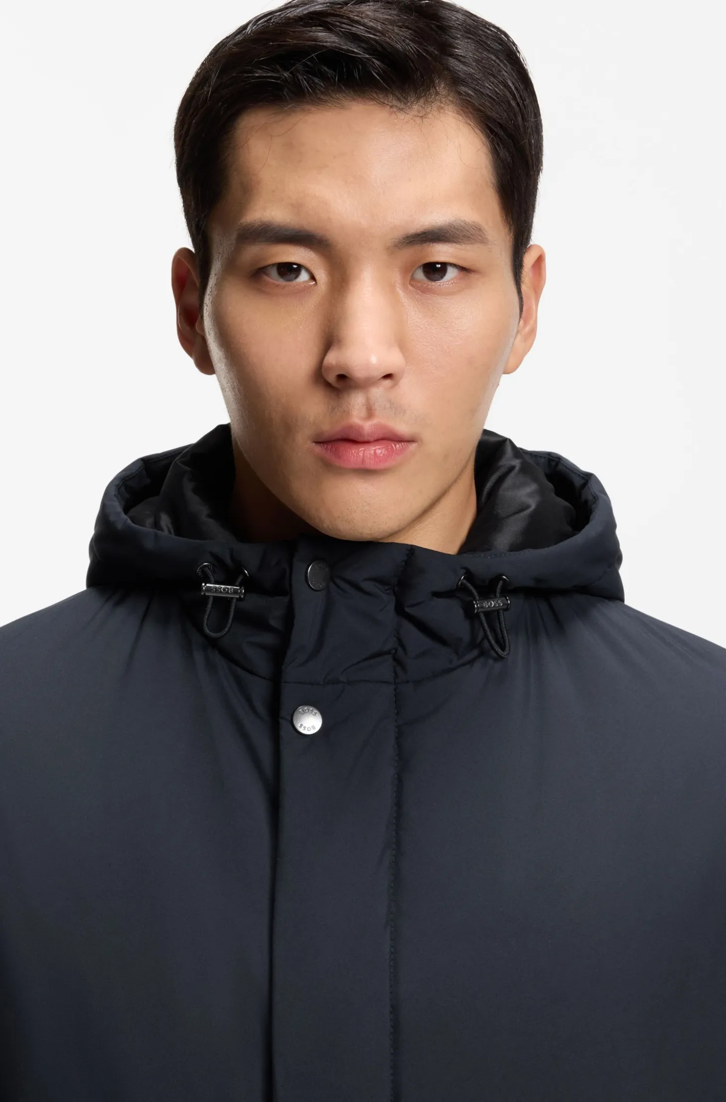 Hooded coat in water-repellent fabric with padding