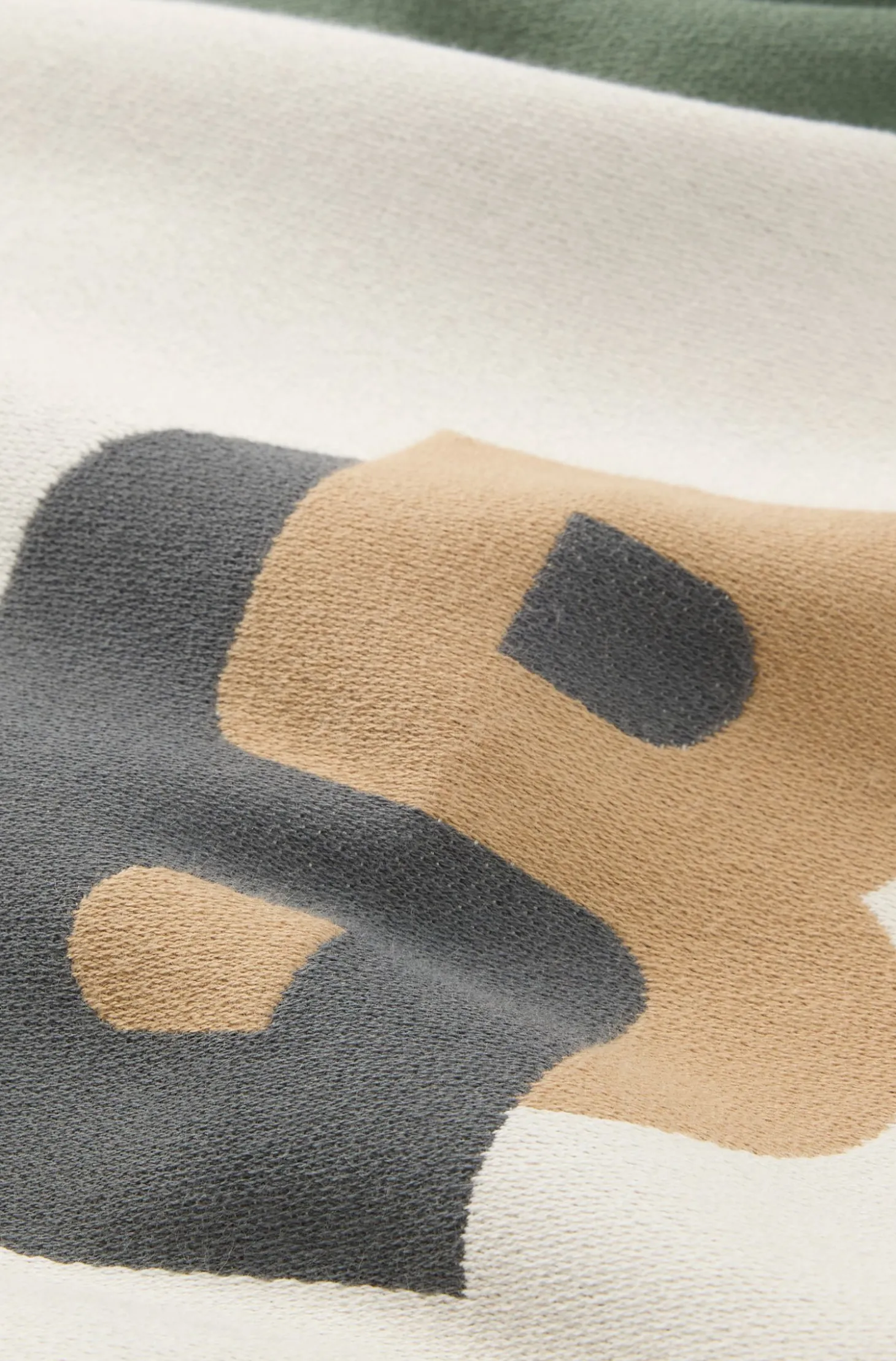 Jacquard cushion cover with whipstitching