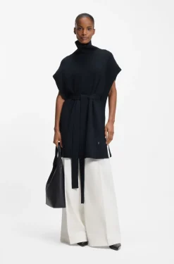 Knitted poncho in virgin wool with high neckline