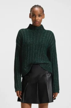 Knitted sweater with ribbed structure