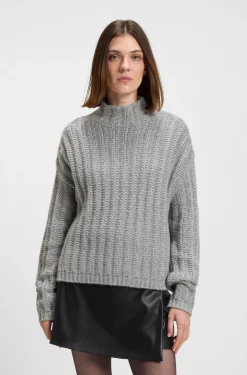 Knitted sweater with ribbed structure