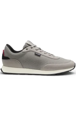 Knitted-upper trainers with logo flag