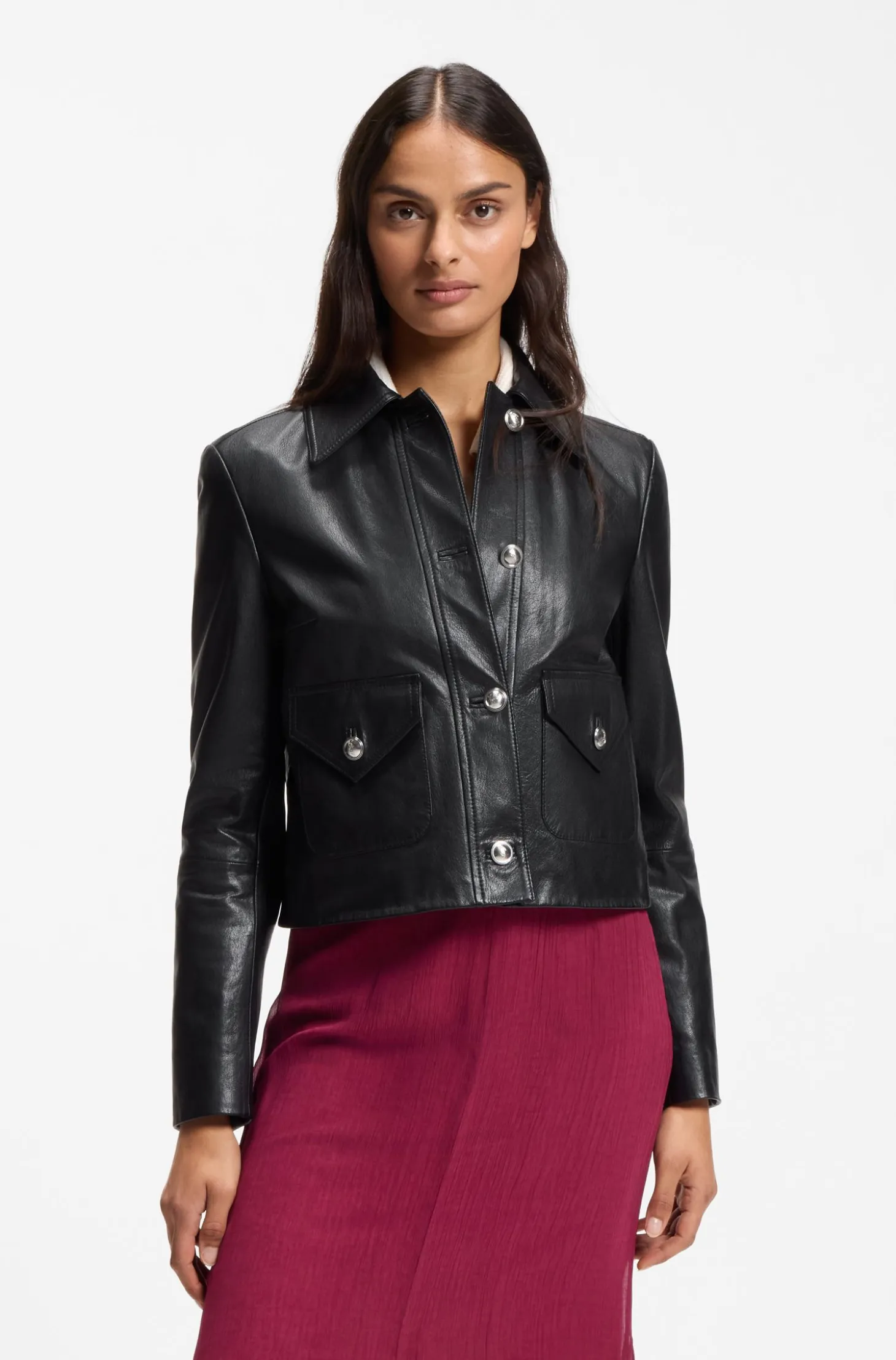Leather jacket with polished logo buttons