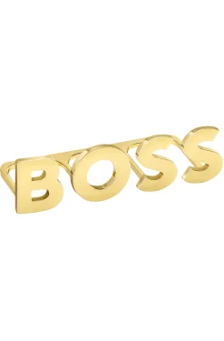 Light-gold tone knuckle ring with logo letters