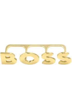 Light-gold tone knuckle ring with logo letters