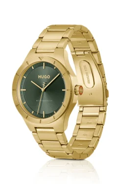 Lit gold-tone watch with green dial