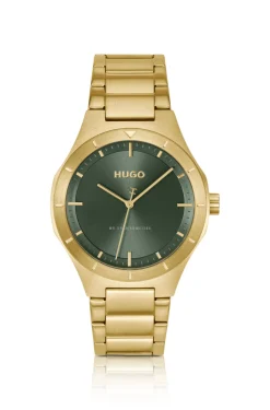 Lit gold-tone watch with green dial