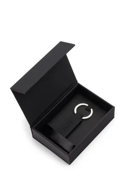 Logo key ring in black silicone and brass