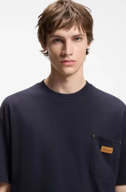 Loose-fit T-shirt in cotton with suede logo badge