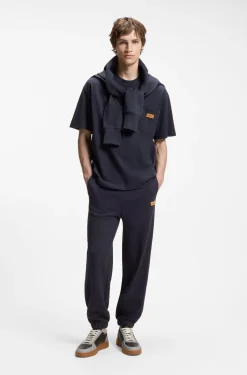 Loose-fit T-shirt in cotton with suede logo badge