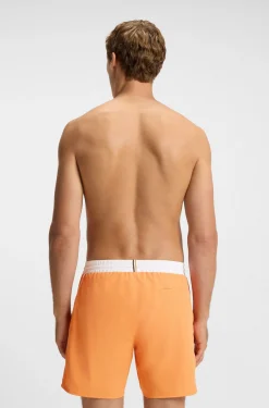 Medium-length swim shorts with contrast details