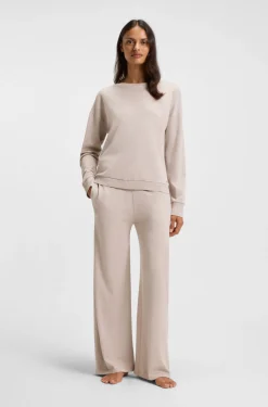 Melange-jersey tracksuit bottoms with logo plate