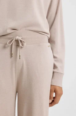 Melange-jersey tracksuit bottoms with logo plate