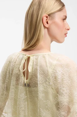Mini cape blouse with lace trimmings