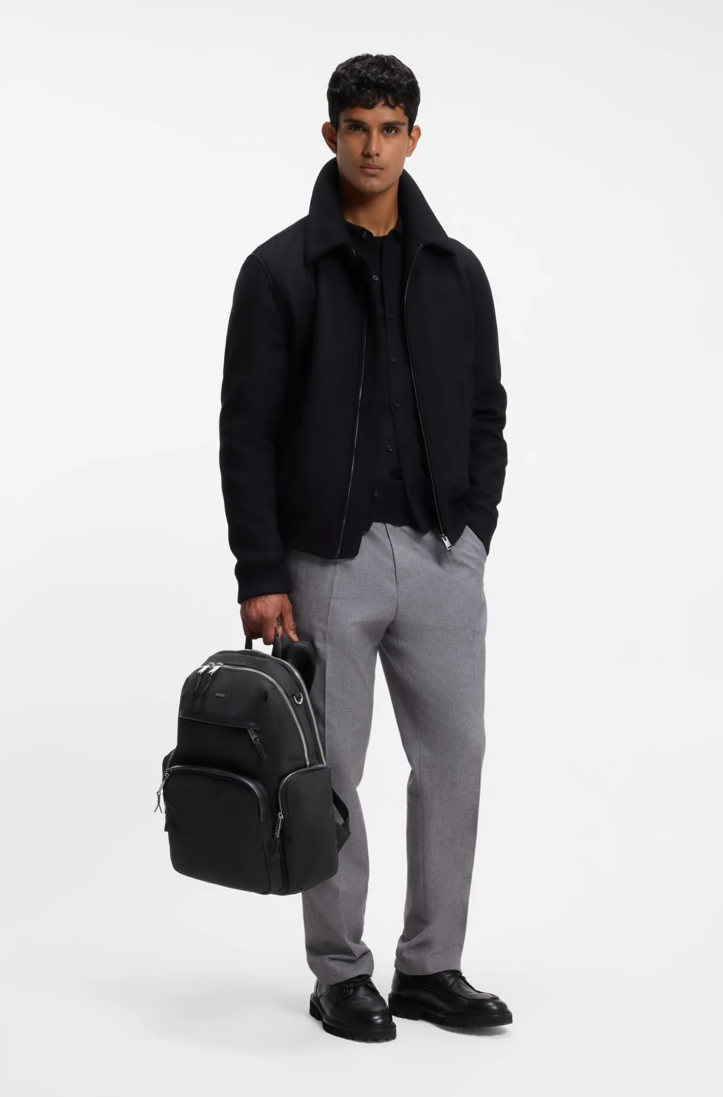 Multi-pocket backpack with leather trims