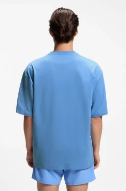 Oversized-fit T-shirt in cotton with repeat-logo print