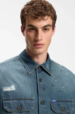 Oversize-fit denim overshirt with paint splashes