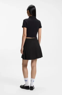 Pleated skirt in stretch cotton with integrated shorts