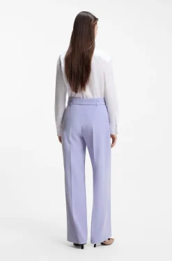 Pleat-front trousers with buckled belt
