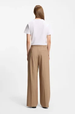 Pleat-front trousers with buckled belt