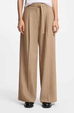 Pleat-front trousers with buckled belt