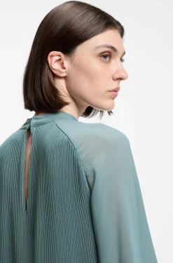 Plissé dress with sheer sleeves