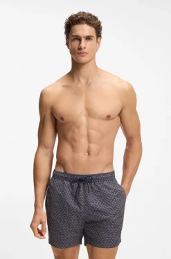 Printed swim shorts with logo badge