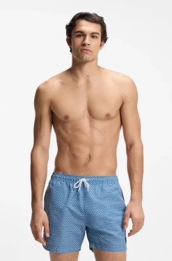 Printed swim shorts with logo badge