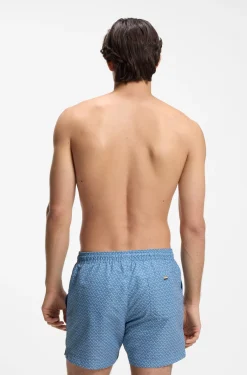 Printed swim shorts with logo badge
