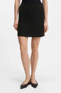 Punto Milano jersey mini skirt with front pockets
