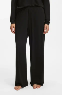 Pyjama bottoms with lace-trimmed pockets
