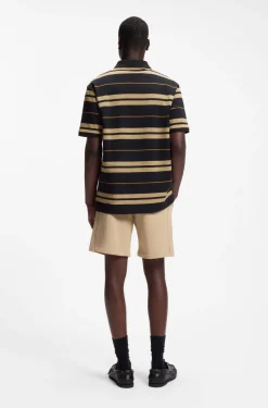 Regular-fit polo in cotton piqué with engineered stripes