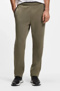 Regular-fit tracksuit bottoms in super-soft stretch fabric