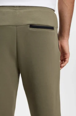 Regular-fit tracksuit bottoms in super-soft stretch fabric
