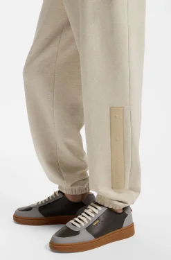 Relaxed-fit tracksuit bottoms in cotton with logo trim