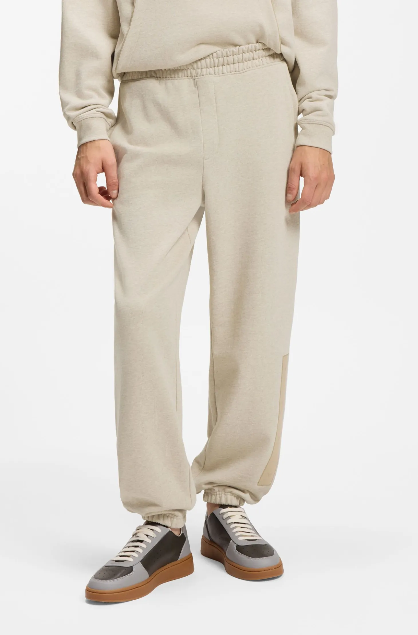 Relaxed-fit tracksuit bottoms in cotton with logo trim