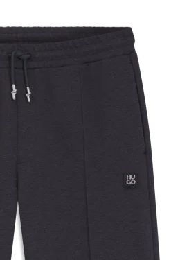 Relaxed-fit tracksuit bottoms with pintuck pleats
