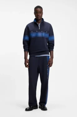 Relaxed-fit tracksuit bottoms in cotton with side stripe