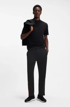 Relaxed-fit tracksuit bottoms with logo tape