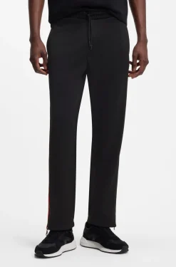 Relaxed-fit tracksuit bottoms with logo tape