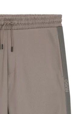 Relaxed-fit tracksuit bottoms with logo tape