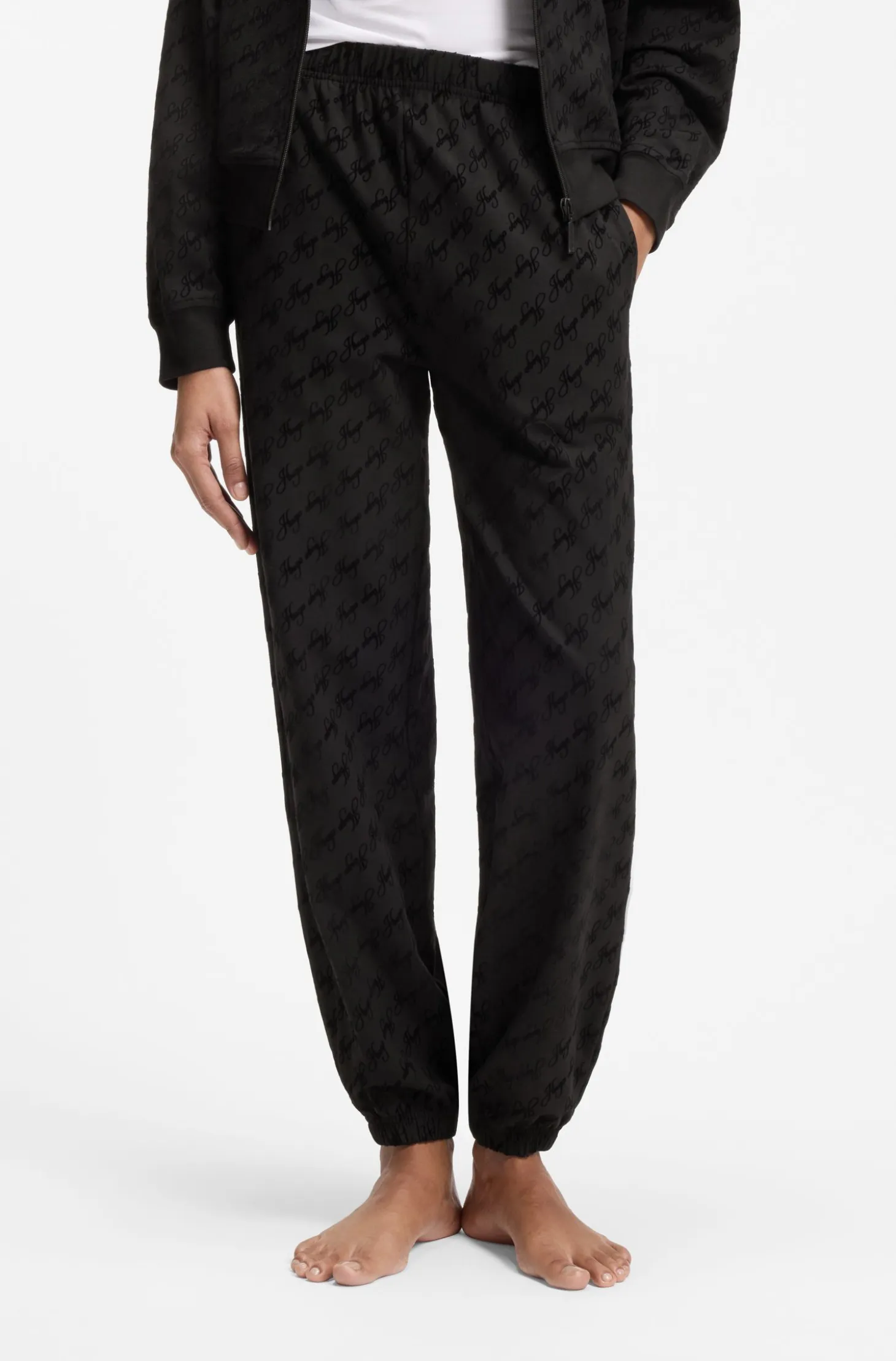Relaxed-fit tracksuit bottoms with flocked-logo print