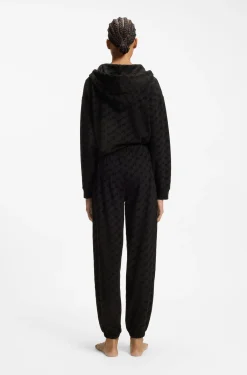 Relaxed-fit tracksuit bottoms with flocked-logo print