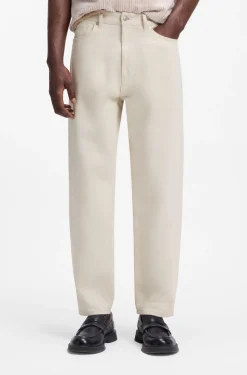 Relaxed-tapered-fit jeans in ecru denim