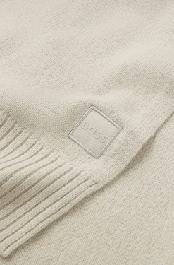 Ribbed-hem plain-knit scarf with woven logo badge