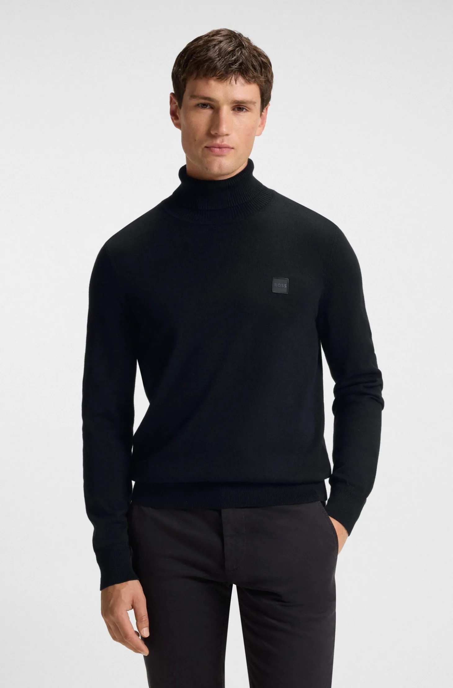 Rollneck sweater in cotton and cashmere with logo patch